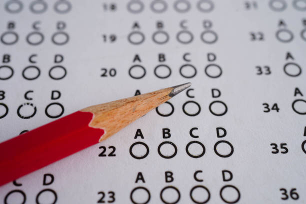 istock Answer sheets with pencil drawing fill to select choice, education concept. 2204042268