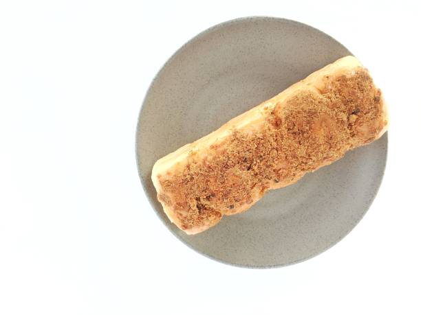 istock Torn Bread on a glass plate with a white background 2204045447