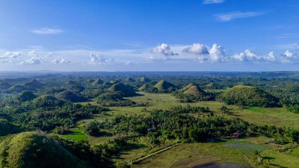 istock Chocolate Hills in Bohol Philippines under blue sky and clouds 2204050915
