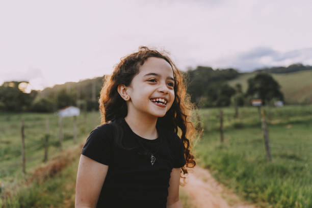 Smiling girl on farm vacation