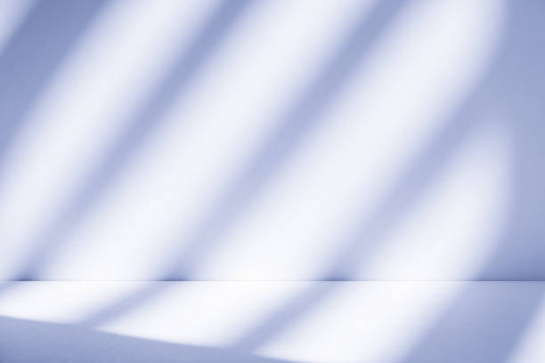 istock Studio style background wall decoration presentation uses white and blue tones. with shadows cast from a nearby window, concept creating a decorative 2204054992