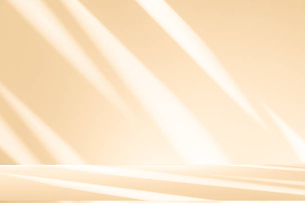istock Studio style background wall decoration presentation uses white and beige tones. with shadows cast from a nearby window, concept creating a decorative 2204055001