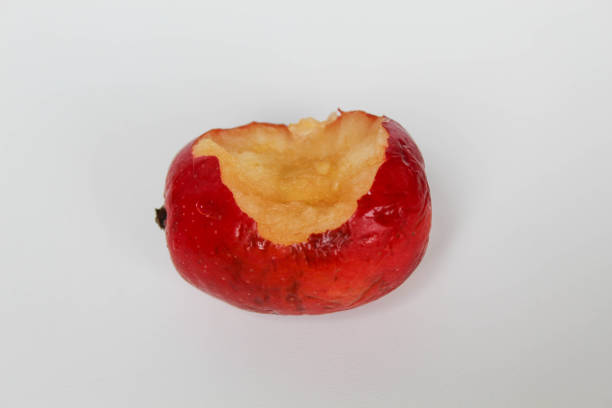 Bitten of strawberry apples or cherry apple, isolated on white background