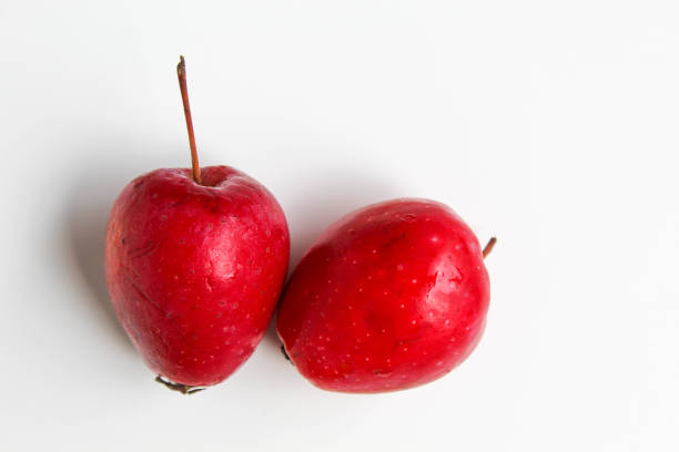 Two strawberry apples or cherry apple, isolated on white background