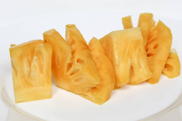 Cut pineapple flesh, isolated on white background