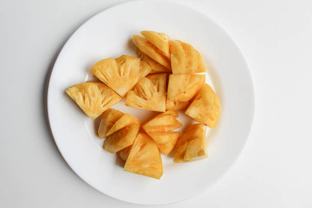 Sliced orange and pineapple on a fruit platter. Macro. Can be used as a  whole background.