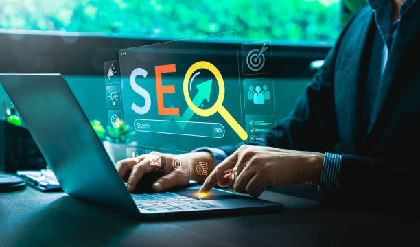 istock Digital Marketing Expert Analyzing SEO Strategies on Laptop with Futuristic Virtual Interface, Highlighting Search Engine Optimization, Website Ranking, Online Growth, Effective Business Visibility 2204065591