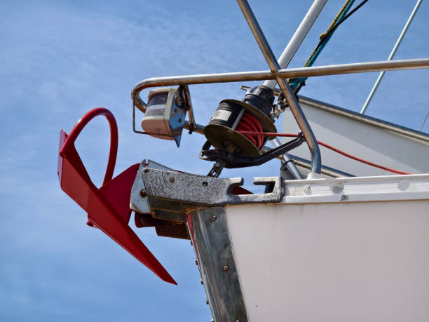 istock A bright red anchor is securely attached to the side of a sailing boat 2204070468