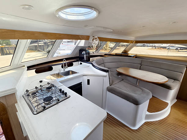 istock A cozy living room and kitchen featuring a stylish curved couch and a table located on sailing boat 2204070749