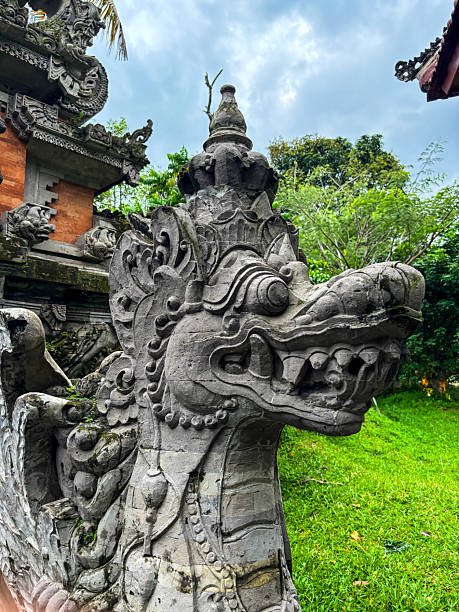 A beautiful Balinese temple decorated with statues and pattens
