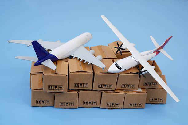 istock Airplanes on many cardboard boxes on blue background. 2204077301