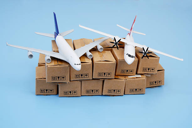 istock Airplanes on many cardboard boxes on blue background. 2204077319