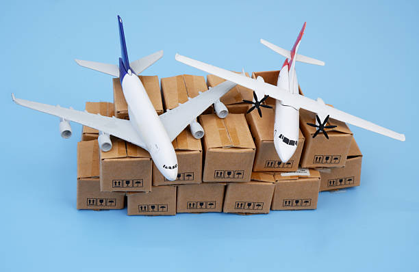 istock Airplanes on many cardboard boxes on blue background. 2204077337
