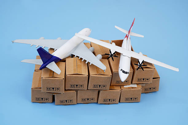 istock Airplanes on many cardboard boxes on blue background. 2204077338