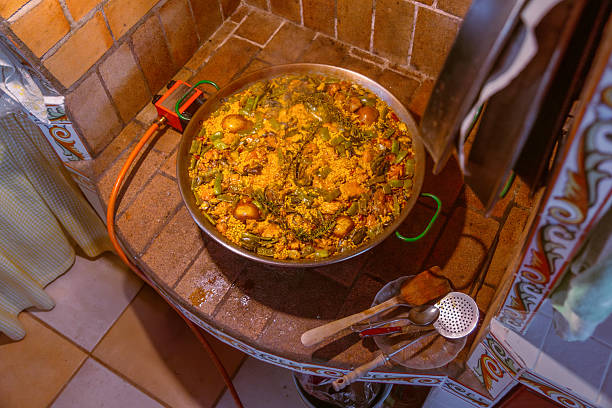 Traditional Valencian paella freshly cooked ready to eat in a rustic kitchen in a Valencian village.