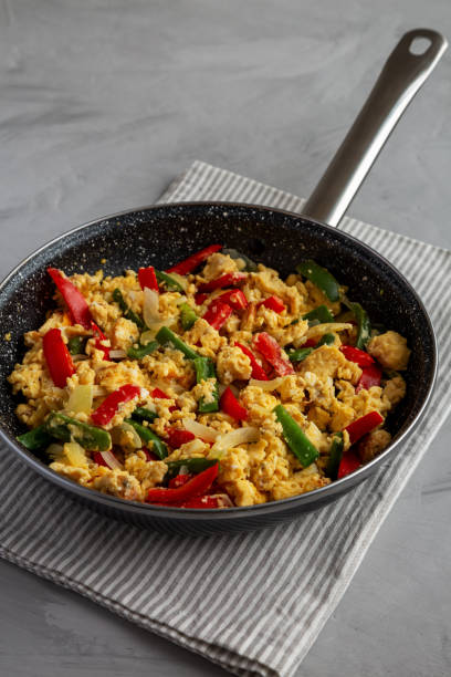 istock Homemade Scrambled Peppers and Eggs in a Pan, side view. 2204081708