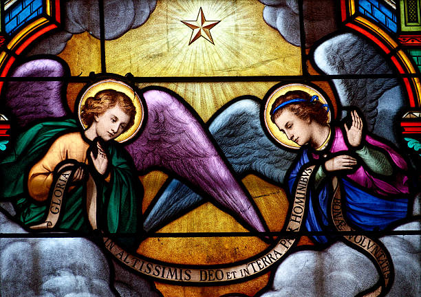 Church Saint Pierre et Saint Germain, Checy, France - 01-26-2025: Stained glass (19th century) of two angels in heaven.