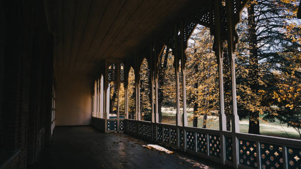 Experience the enchanting Gothic architecture set against a backdrop of vibrant autumn trees