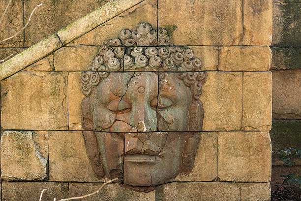 A striking stone carving of a historical face embedded in a weathered wall. This evocative image blends cultural heritage with artistic mystery, ideal for heritage, archaeology, and art-themed projects.