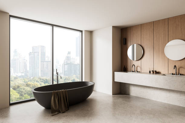 istock Modern bathroom interior with city view and freestanding tub. 3D Rendering 2204096096
