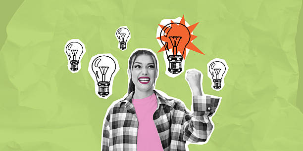 istock Woman celebrating new idea with lightbulb sketches on green back 2204096202