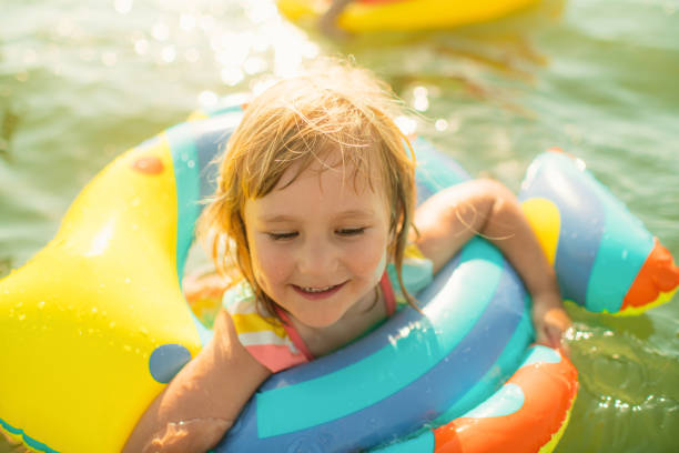 istock Little girl enjoying beach holidays 2204097751