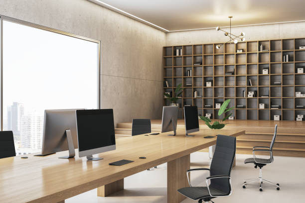 istock Modern office interior with wooden desk, computers, and bookshelves. 3D Rendering 2204099191