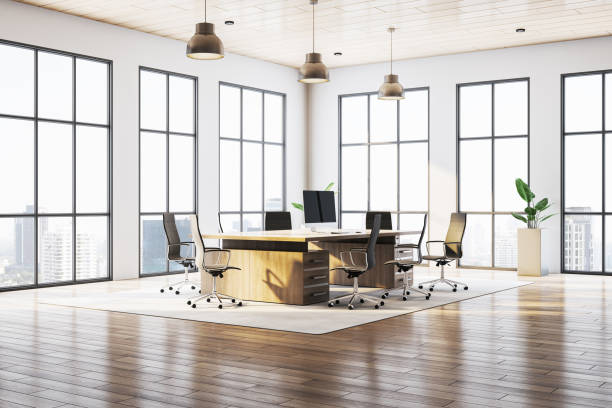 istock Modern office interior with wooden desk and chairs in a bright workspace. 3D Rendering 2204099210