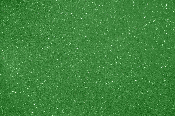 istock Bright green glitter texture background with sparkling details and shimmering effect 2204099600