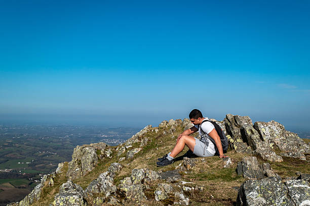 Young tourist resting on top of the Ainhoa ​​mountain in the Basque Country