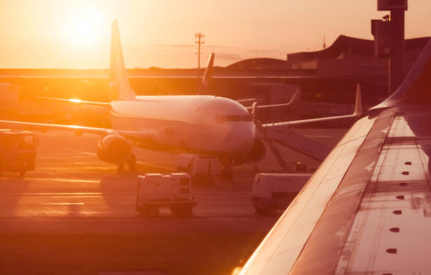 istock Airplane at sunset on the runway. 2204104504
