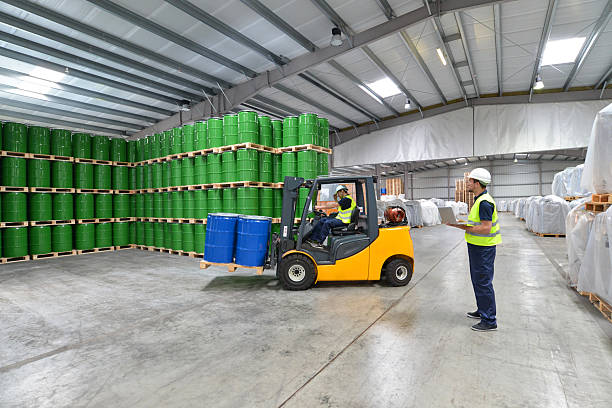 istock group of workers in the logistics industry work in a warehouse with chemicals 2204104857