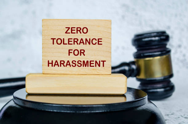 istock Zero Tolerance For Harassment text written on wooden board with lawyer gavel background. Harassment concept 2204112729