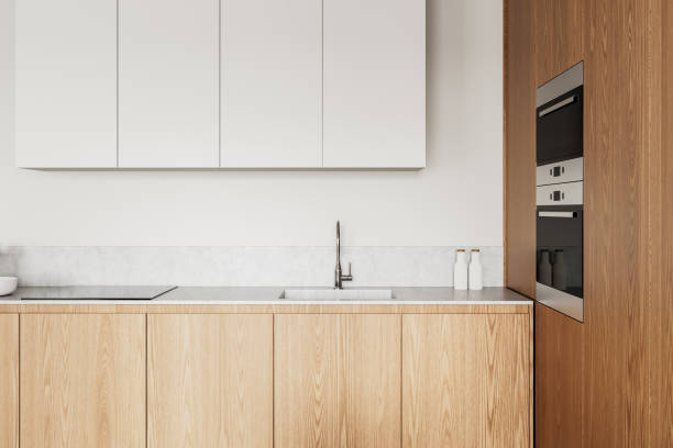 istock Modern kitchen interior with wooden cabinets and white upper storage. 3D Rendering 2204113504