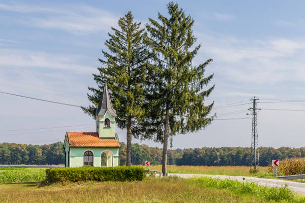 Small chapel designed as typical Slovenian church in Kalce-Naklo in Slovenia during summertime