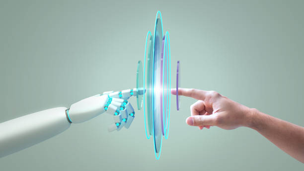 istock A robot hand and a human hand touching each other, technology, generative ai, artificial intelligence, llm, large language model concept 2204118618