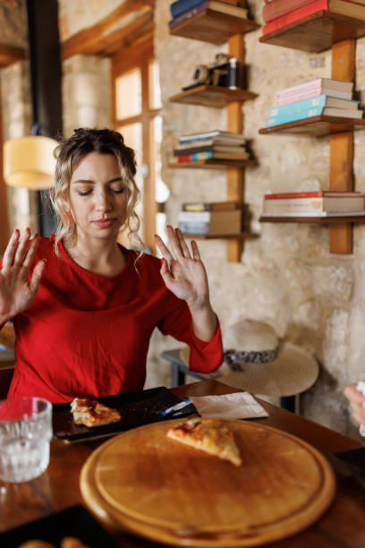 istock Enjoying the taste of pizza 2204119070