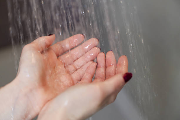 istock Hands Under Falling Water in Shower Symbolizing Hygiene and Wellness 2204119160