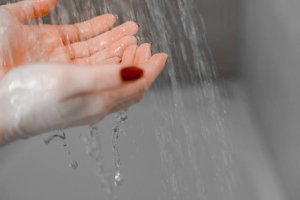 istock Hands Under Flowing Water in a Shower – Relaxing and Refreshing 2204119748