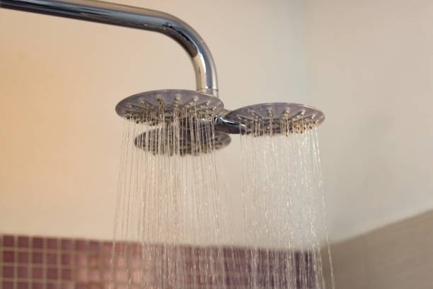 istock Luxurious Dual Showerhead with Flowing Water in a Spa-Like Bathroom 2204120648