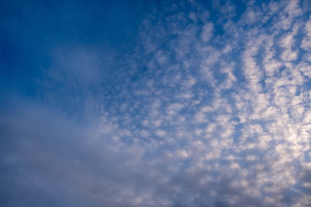 istock A Stunningly Beautiful Blue Sky Filled with Patterned Clouds at Dusk, Creating a Peaceful Atmosphere 2204123639