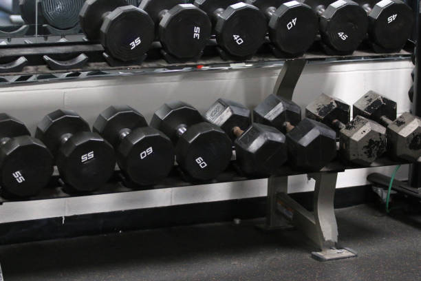 istock Weights Neatly Arranged on a Rack in a Gym During a Fitness Training Session 2204125251