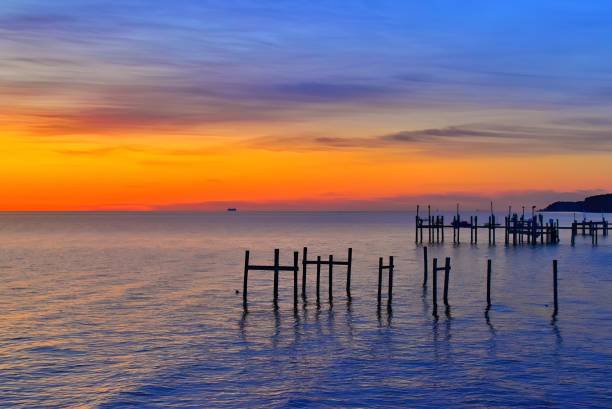 istock Dawn sky over Chesapeake Bay and piers 2204128986