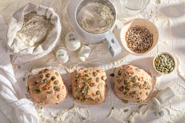Crisp and golden pumpkin seed rolls fresh from the bakehouse. A showcase of ingredients in the bakery.