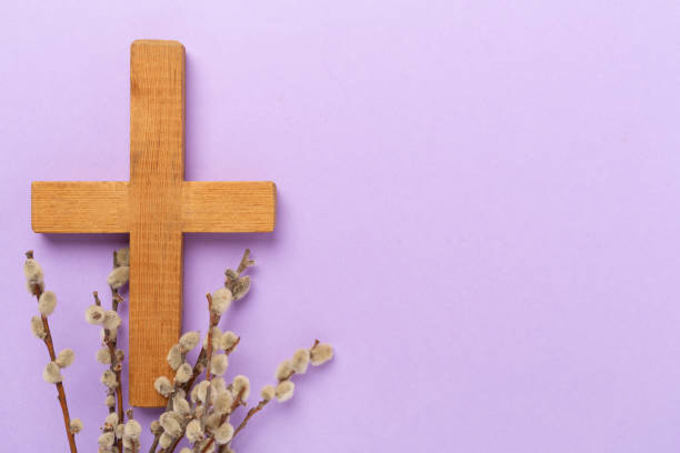 istock Cross with willow branches on color background, top, view. Palm Sunday concept 2204130771
