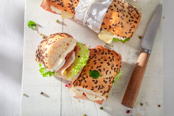 istock A wholesome and nutritious sandwich with prosciutto, Camembert, and mayonnaise. 2204133396