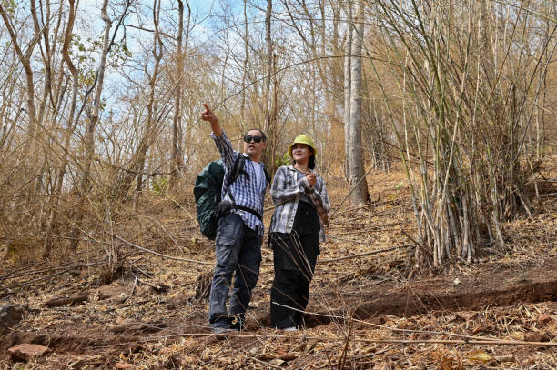 istock Male and female hiking on mountain  with standing on cliff with pose 2204133736