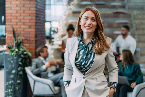 istock Confident businesswoman and her team. 2204135406