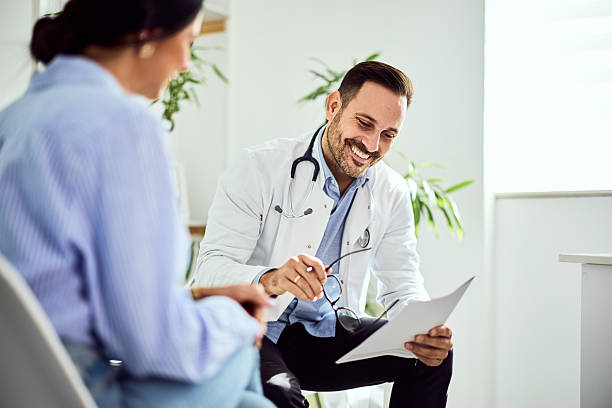 istock Smiling Doctor Discussing Test Results With Patient During Office Consultation 2204147727