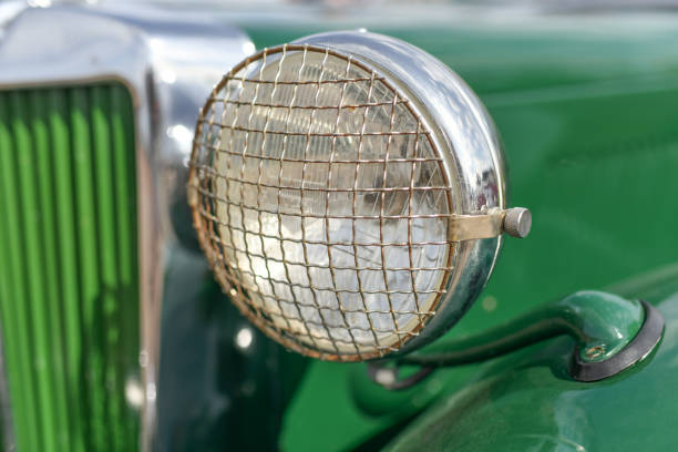 istock Close up green vintage car chrome rusty rearview side mirror 2204148155